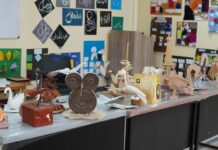 Creativity on Display: A Vibrant DDCA Exhibition at UOR A softly lit exhibition space with curated artwork displayed against neutral walls, a calm creativity and immersive aesthetic atmosphere.