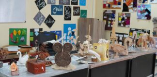 Creativity on Display: A Vibrant DDCA Exhibition at UOR A softly lit exhibition space with curated artwork displayed against neutral walls, a calm creativity and immersive aesthetic atmosphere.