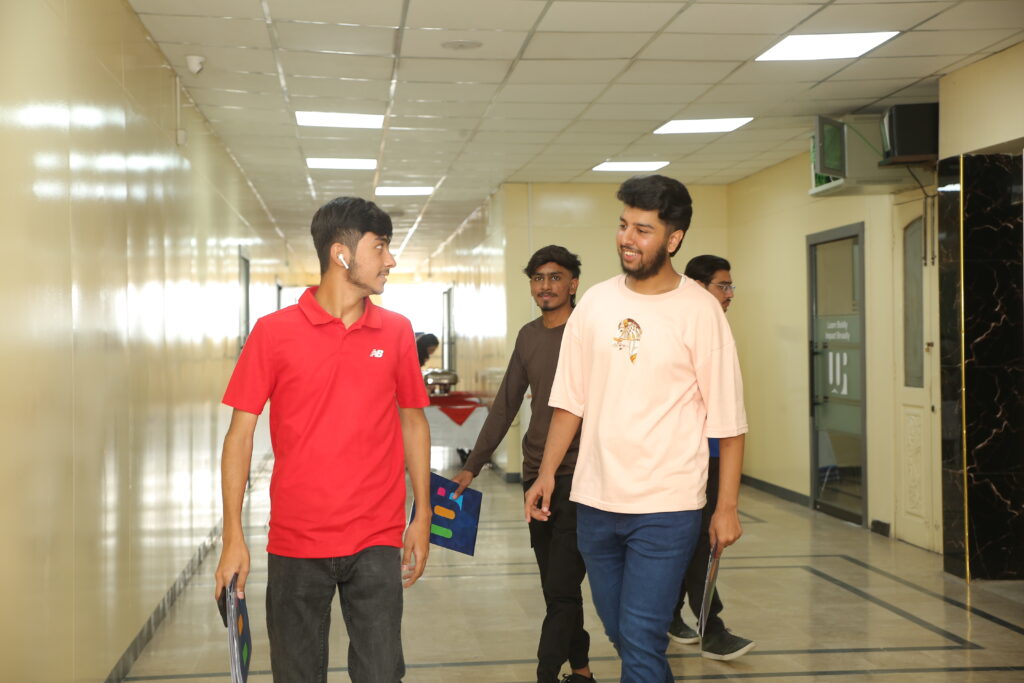 University student walking across campus while exploring academic opportunities.