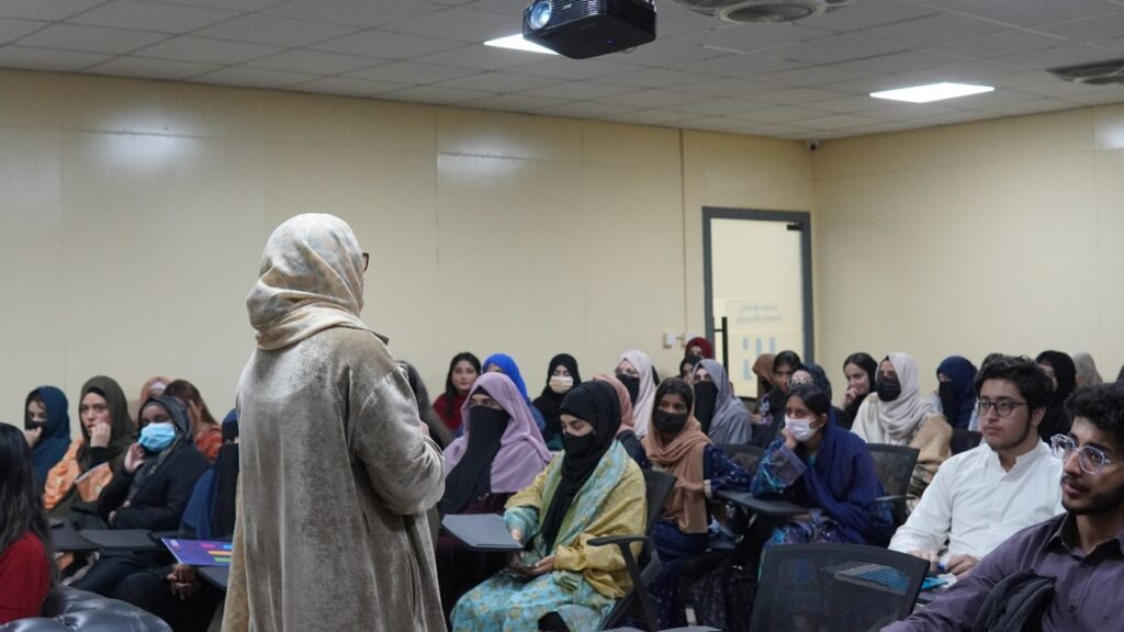 Orientation session at University of Rawalpindi where faculty explain university guidelines to first-year students.